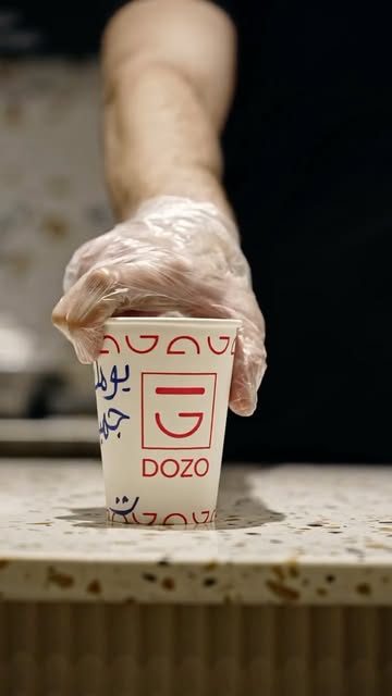 A DOZO cup on the terrazzo counter